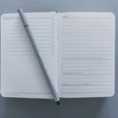 Image of a notebook and pen