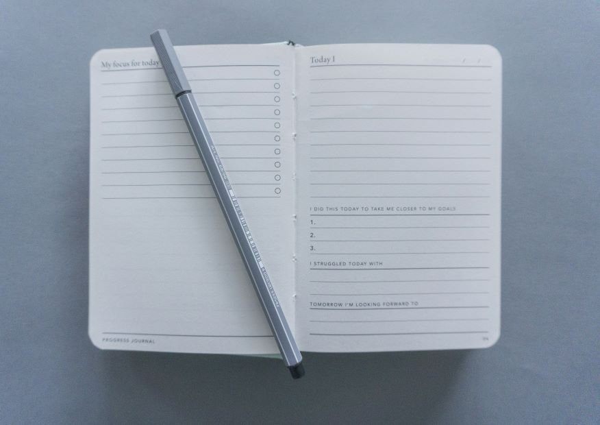 Image of a notebook and pen